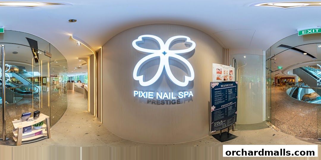 The entrance of Pixie Nail Spa, featuring its illuminated logo and a displayed service menu.