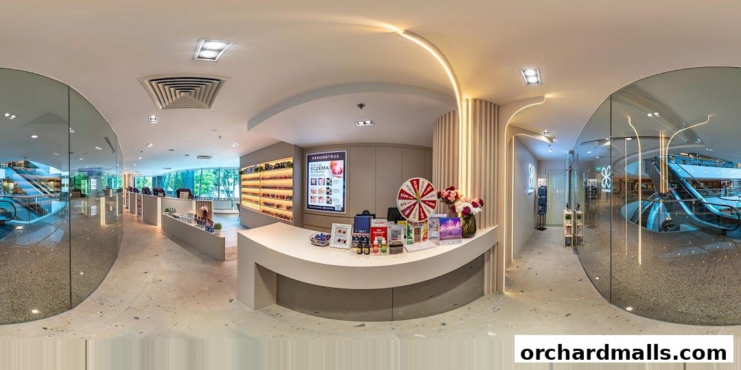 Interior view of Pixie Nail Spa with a reception desk, product displays, and a promotional wheel.
