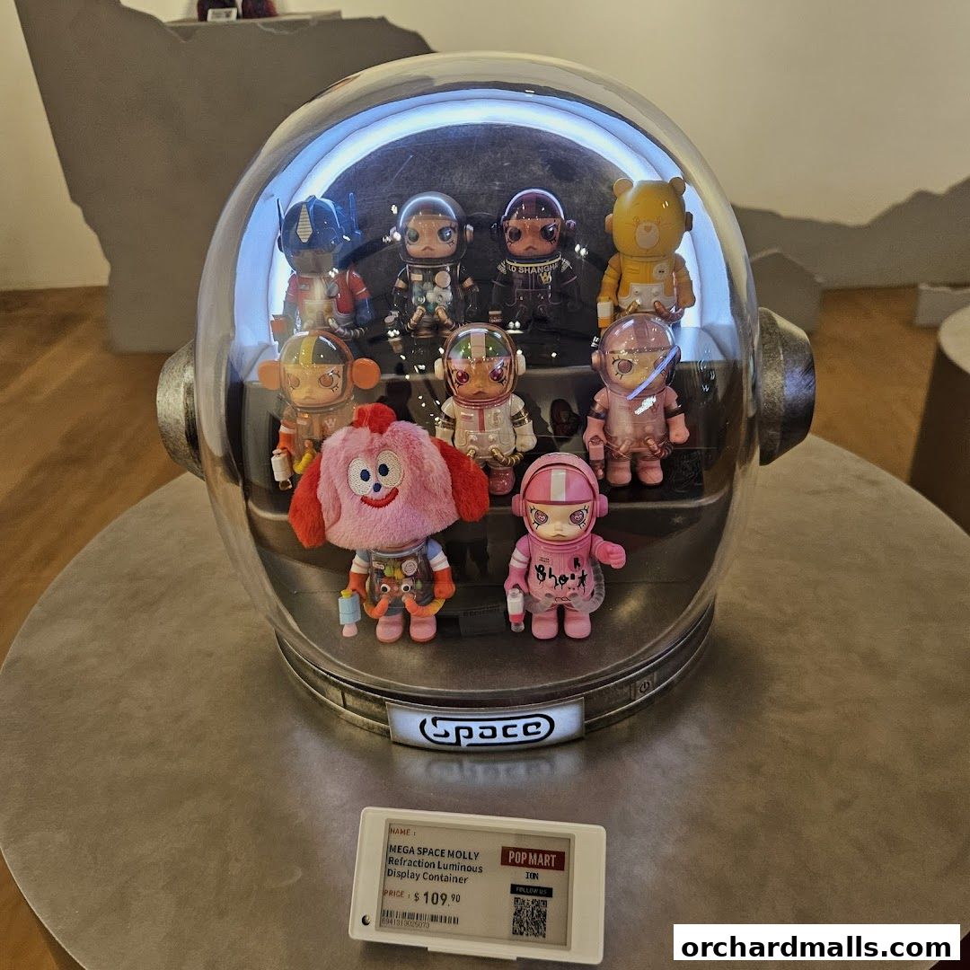 A display of collectible figures inside a helmet-shaped container at POP MART.