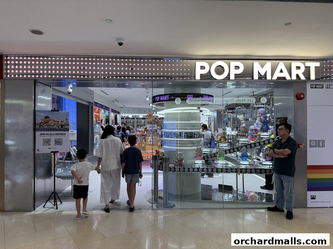 The entrance of a POP MART store with various collectible toys displayed inside.