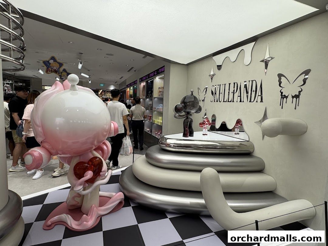 Interior of a POP MART store featuring large character figures and merchandise displays.