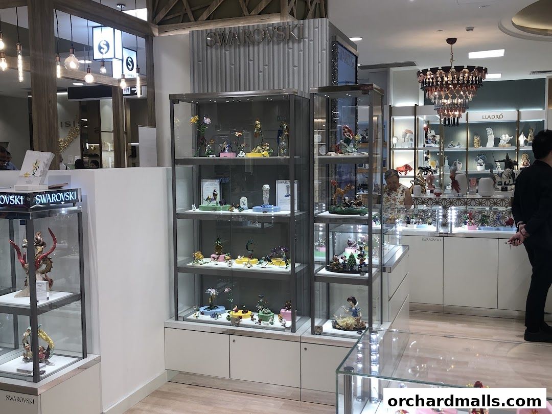Interior of a POP MART store showcasing display cabinets filled with collectible figurines.