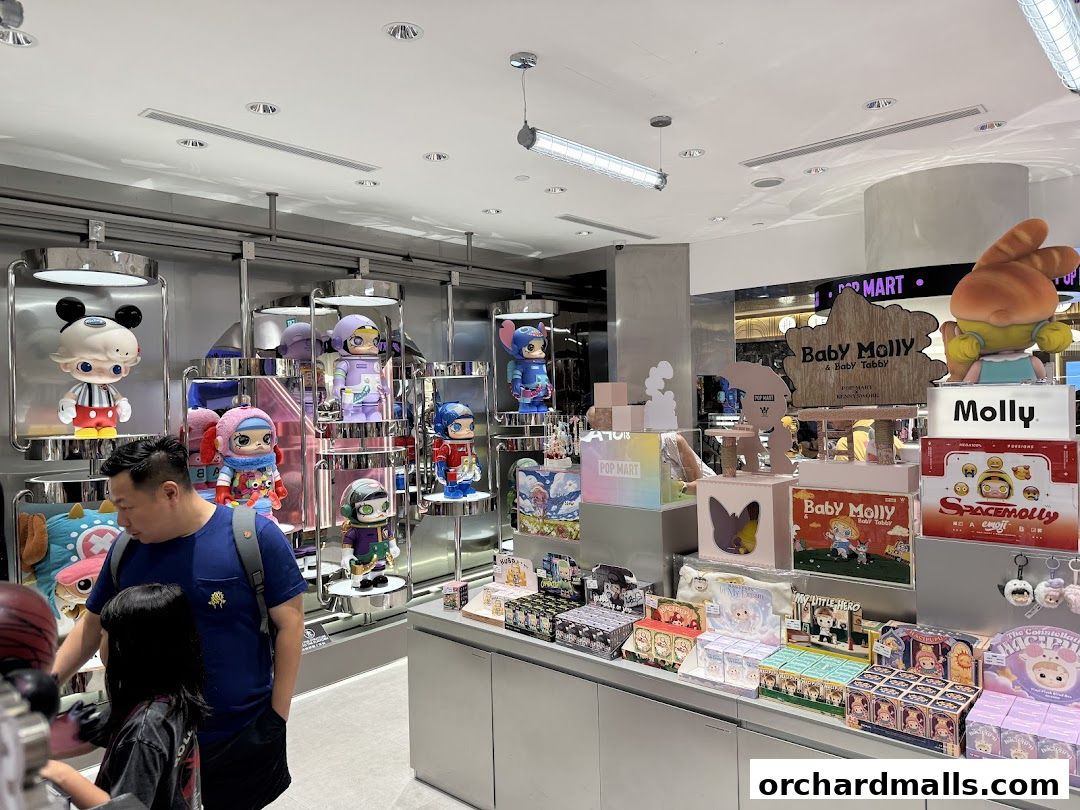 Interior view of a POP MART store showcasing various collectible designer toys and figures.