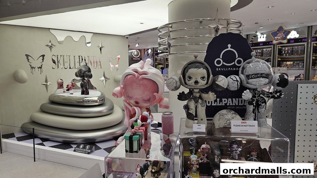 A display of unique SKULLPANDA art toys and collectibles in a retail store.