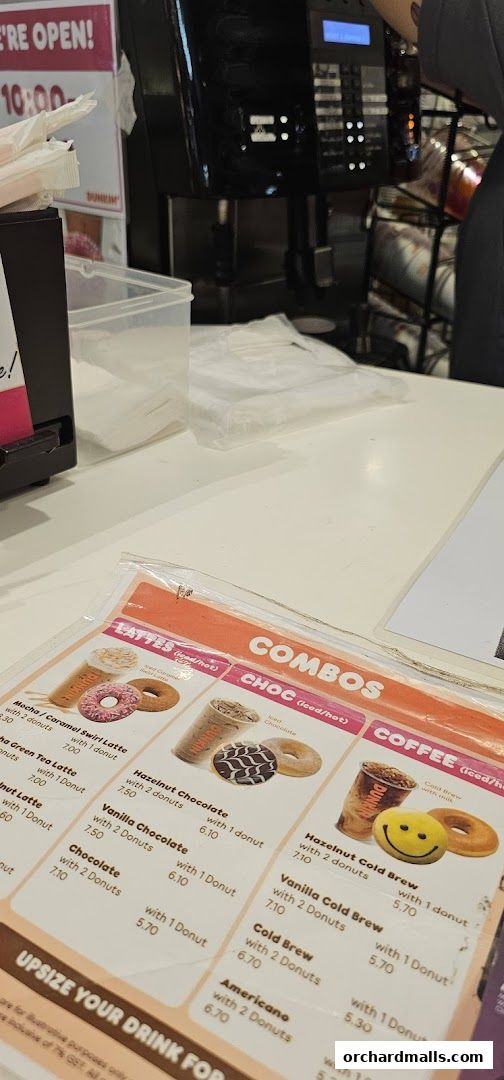 A menu from Dunkin' featuring lattes, combos, and coffee with donuts.