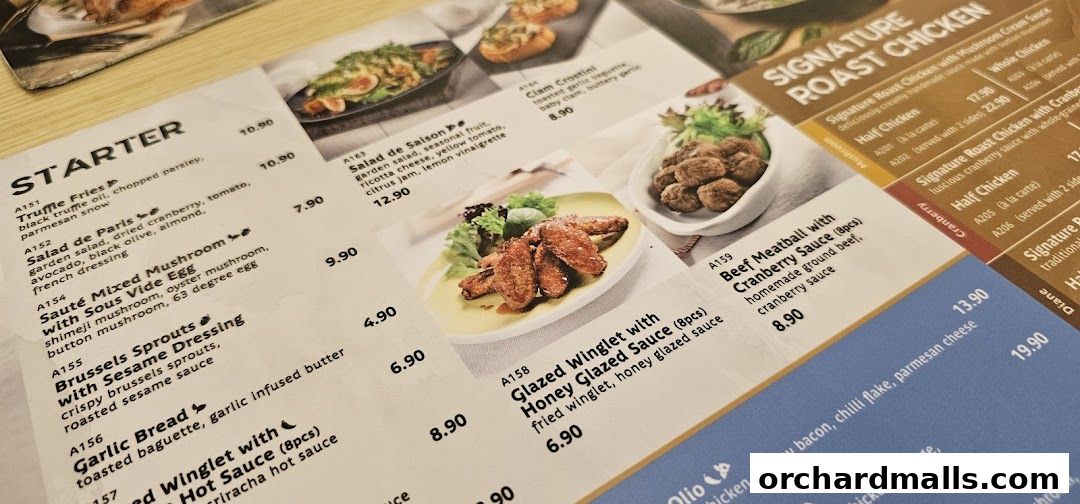 A close-up view of a restaurant menu featuring various dishes with appetizing images.