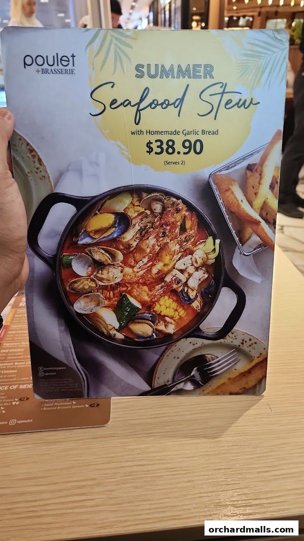 A menu featuring Poulet + Brasserie's Summer Seafood Stew with garlic bread.