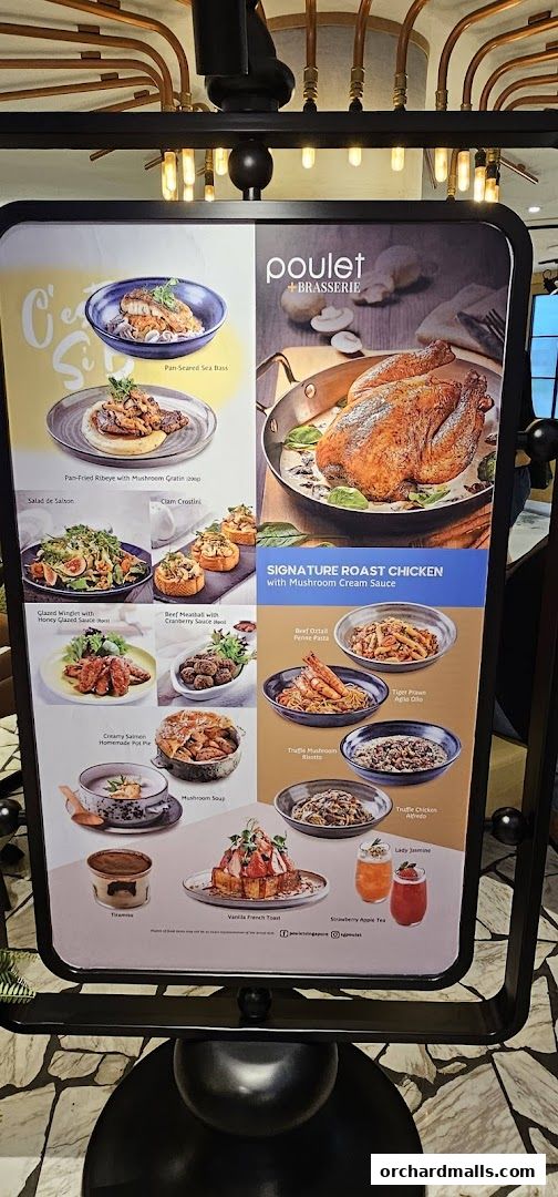 A menu board displaying various dishes from Poulet + Brasserie, including roast chicken and pasta.