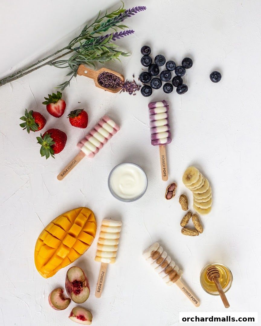 A vibrant flat lay of delicious fruit-flavored popsicles with fresh ingredients.