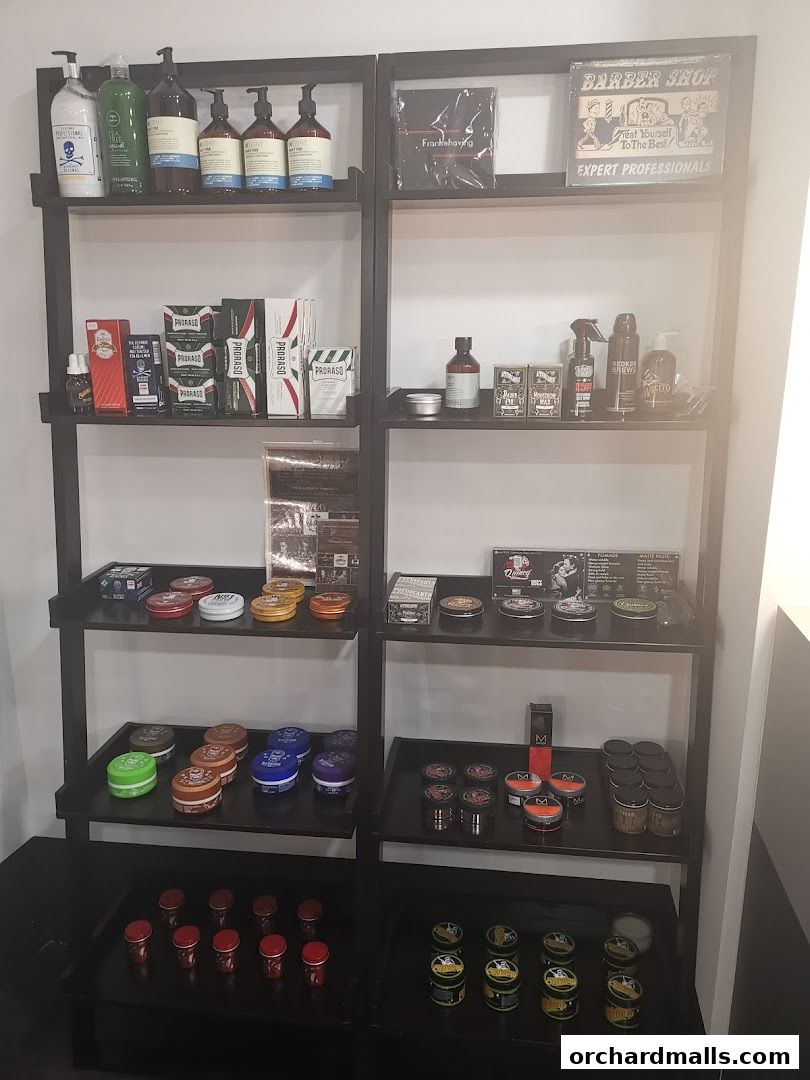 Shelves display a variety of grooming products for men, including shampoos, conditioners, and styling products.