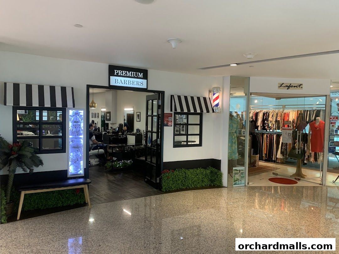 The entrance of Premium Barbers, a stylish barbershop with a classic barber pole.