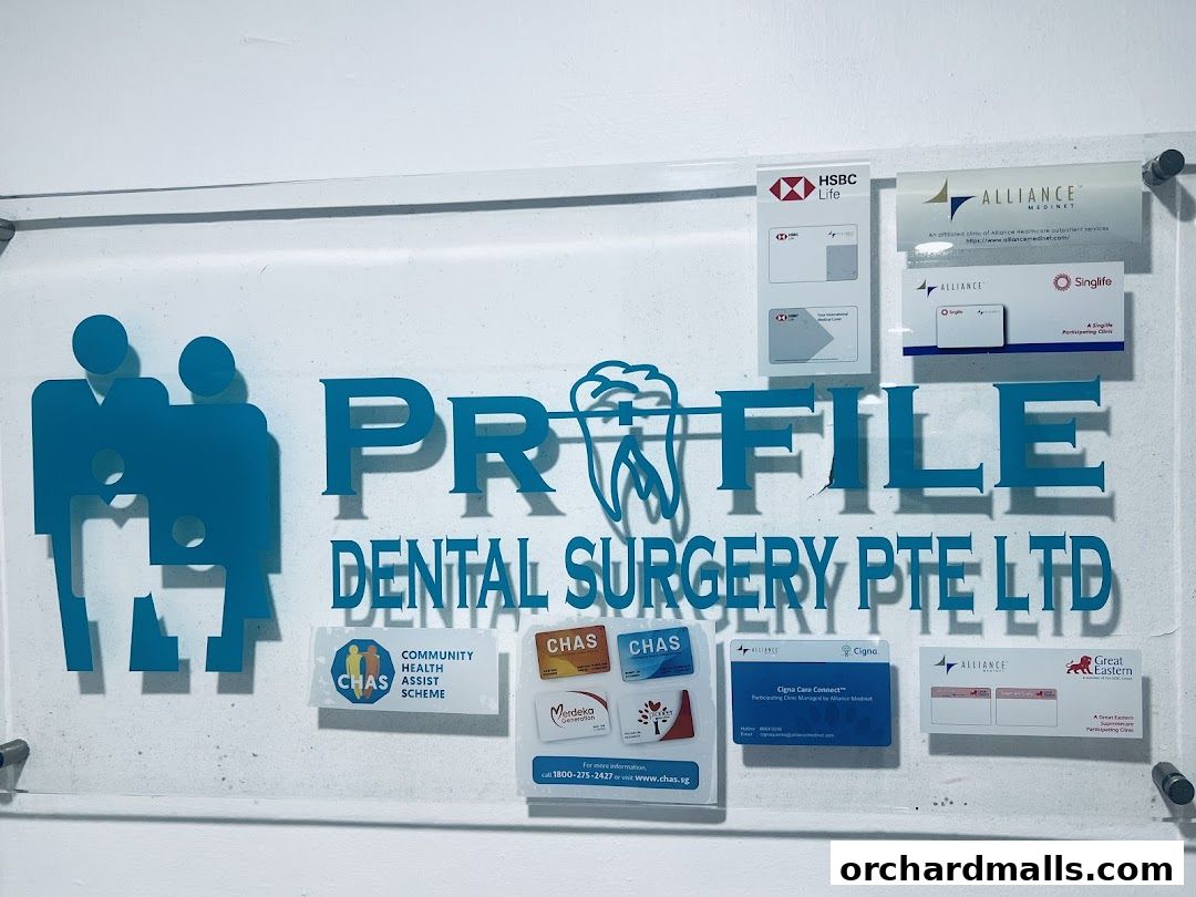 Signage for Profile Dental Surgery Pte Ltd, displaying logos and affiliations.