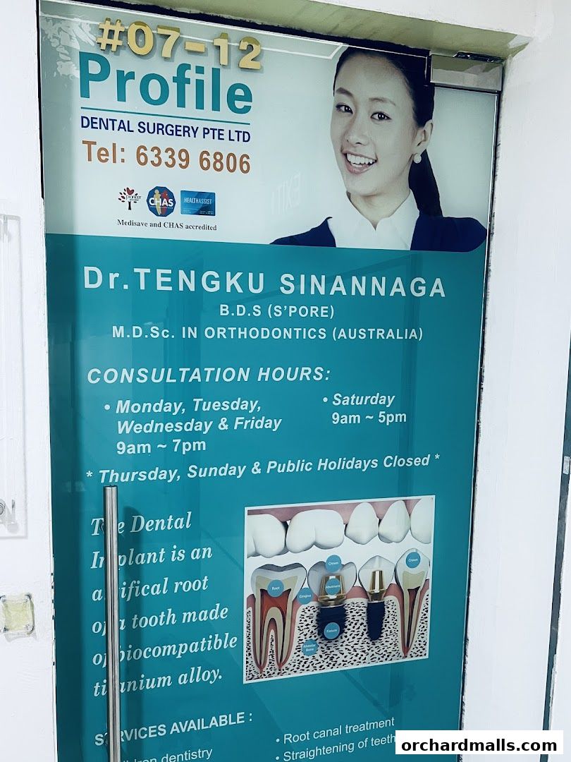 Exterior signage for Profile Dental Surgery Pte Ltd, featuring doctor's name and consultation hours.