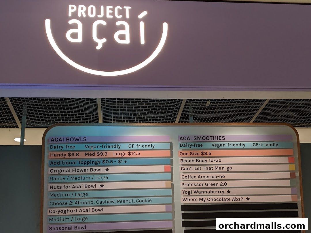 A menu board for Project Acai, displaying acai bowls and smoothies with prices.