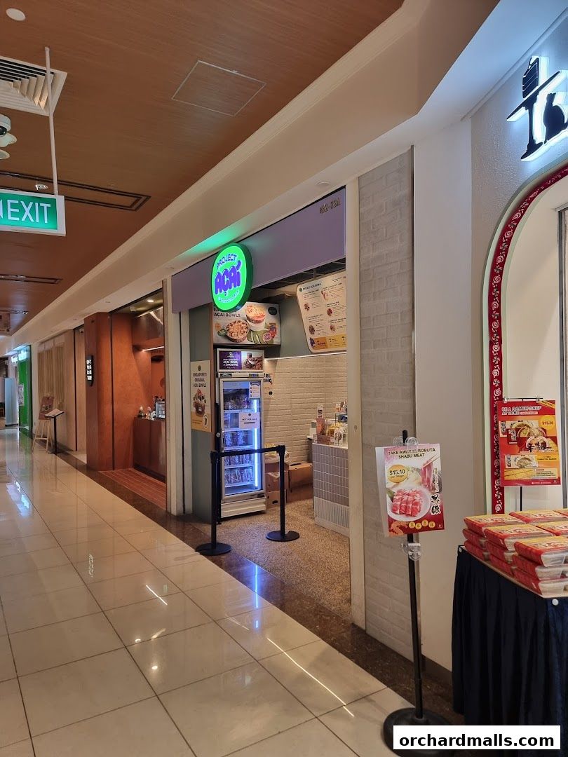 The entrance to Project Acai Ngee Ann City, a vibrant shop offering acai bowls and healthy treats.