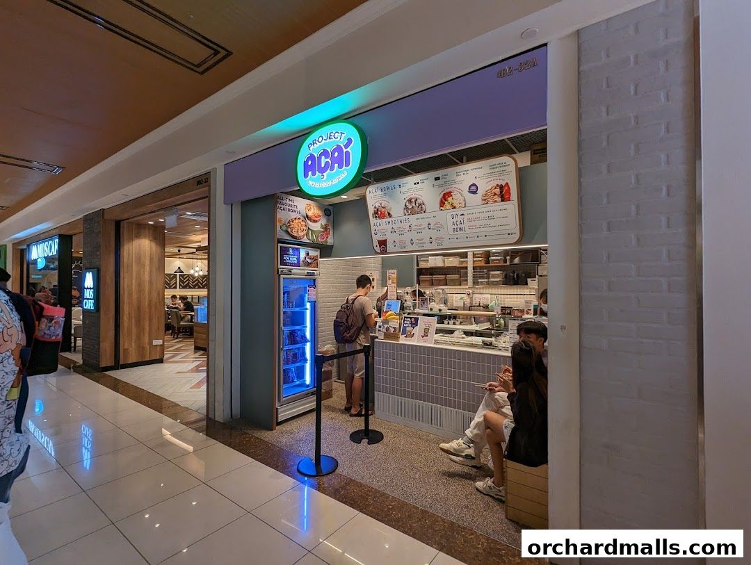 Project Acai Ngee Ann City shop front with a menu and customers ordering.