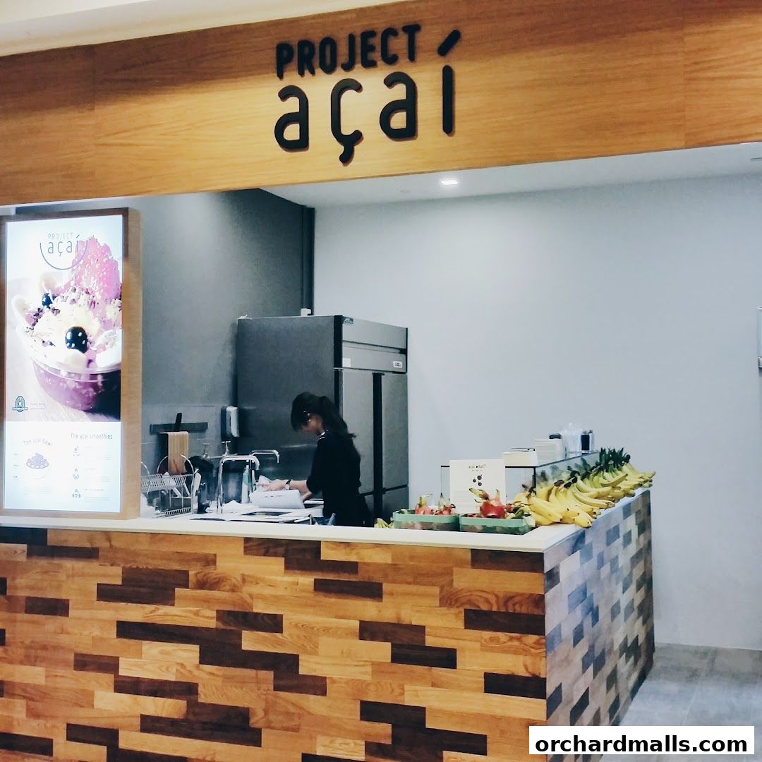 Project Acai Ngee Ann City shop counter with a staff member preparing orders.