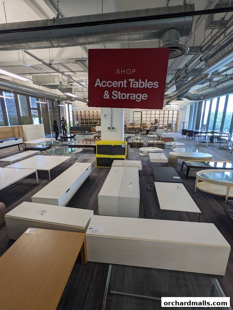 A retail store interior showcasing a variety of accent tables and storage units.