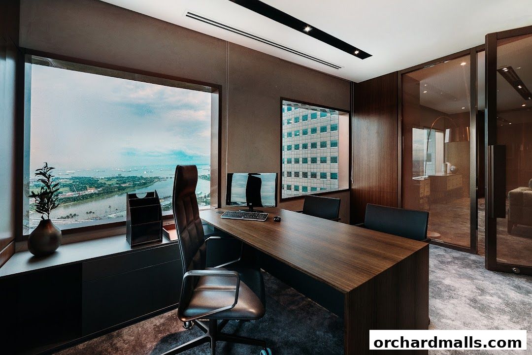 A modern office interior with a large desk, executive chair, and city views.