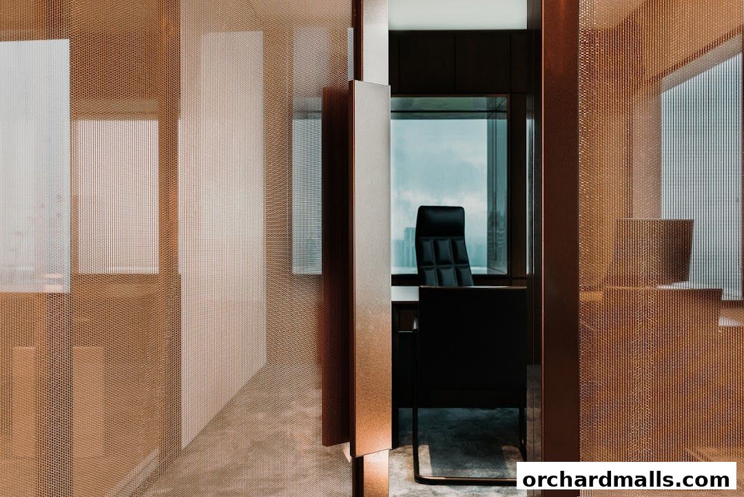 Modern office interior with a black executive chair and a view of the city skyline.