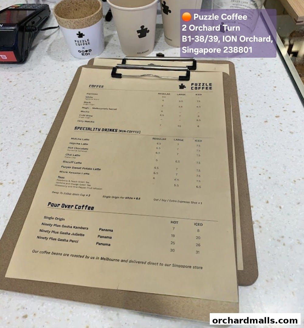 A menu for Puzzle Coffee featuring coffee, specialty drinks, and pour-over options.