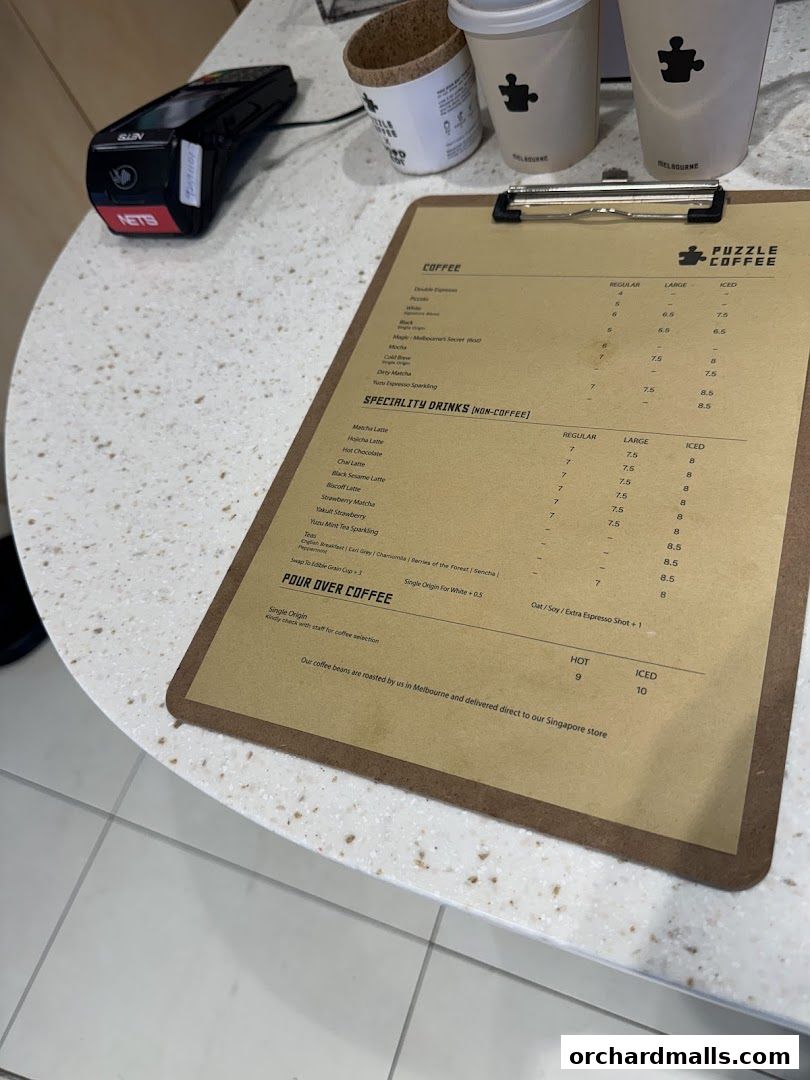 A menu for Puzzle Coffee with various coffee and specialty drink options.