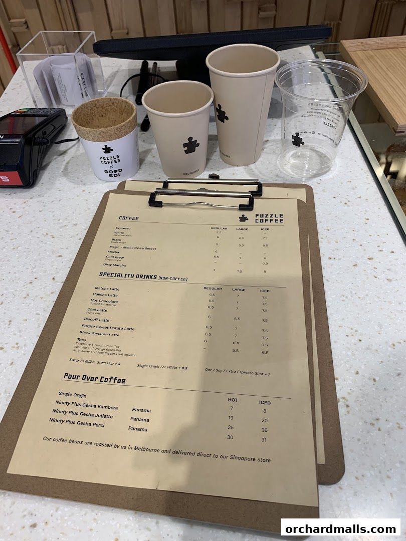 A menu from Puzzle Coffee featuring coffee, specialty drinks, and pour-over options.