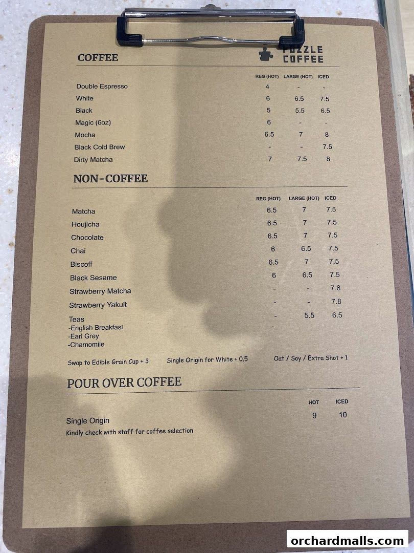 A menu from Puzzle Coffee featuring coffee and non-coffee drinks, with prices for hot and iced options.