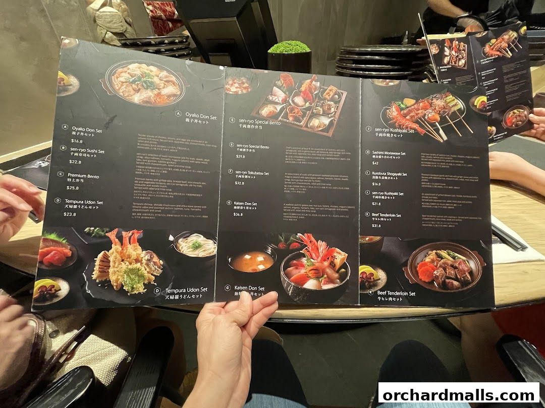 A tri-fold menu from Sen-ryo restaurant showcasing various Japanese set meals with appetizing food photography.