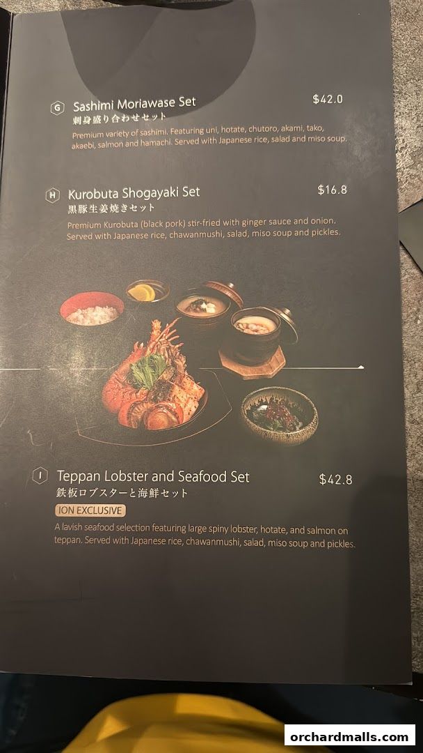 A menu featuring Japanese sets including sashimi, pork, and lobster with seafood.