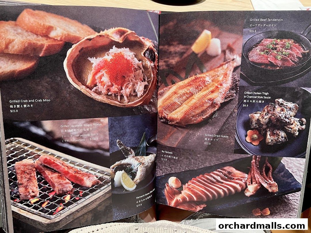 A menu featuring various grilled Japanese dishes, including crab, wagyu beef, and seafood.