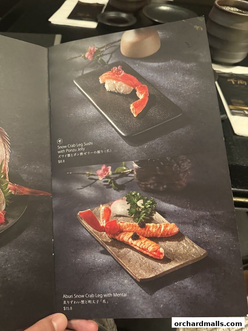 A menu featuring exquisite snow crab sushi dishes with detailed descriptions and prices.