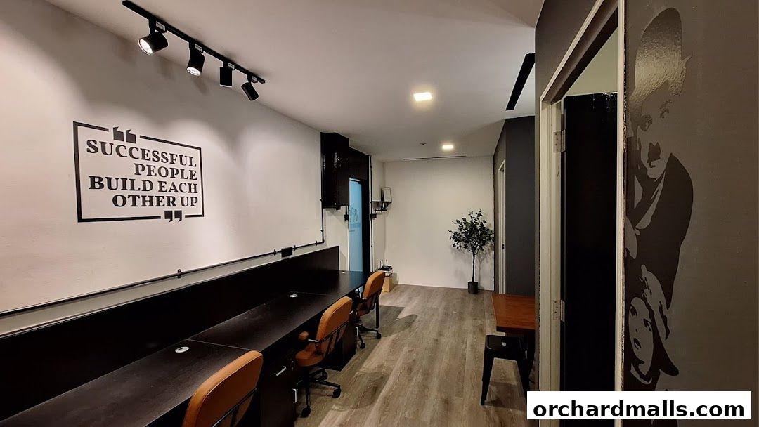 Modern office space with motivational wall art and workstations.