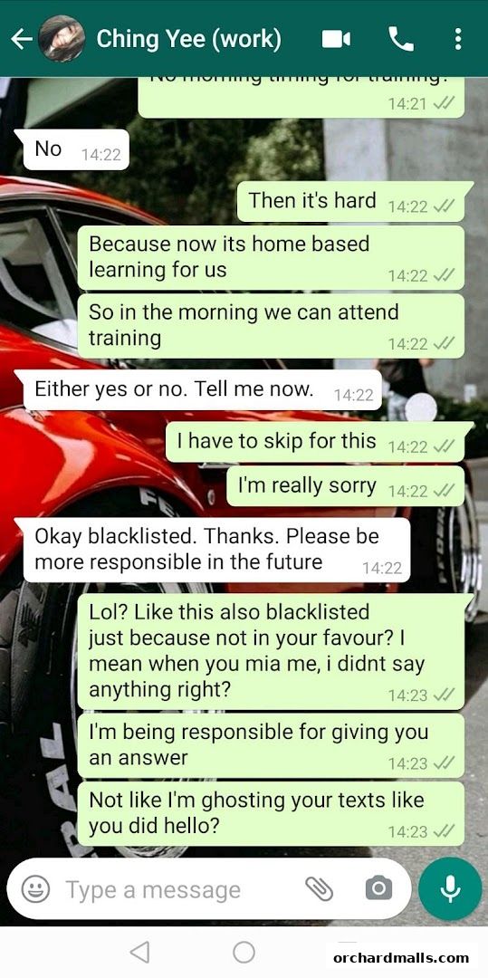 A screenshot of a WhatsApp conversation with a red car in the background.