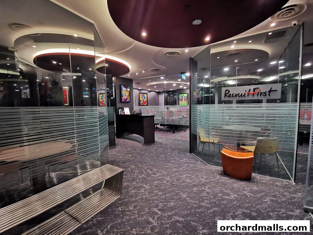 Interior view of RecruitFirst Singapore office with modern design and artwork.