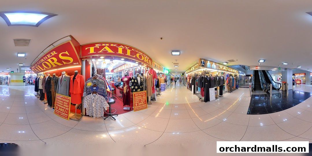 Exterior view of Richie's Custom Tailors shop with mannequins displaying suits and dresses.