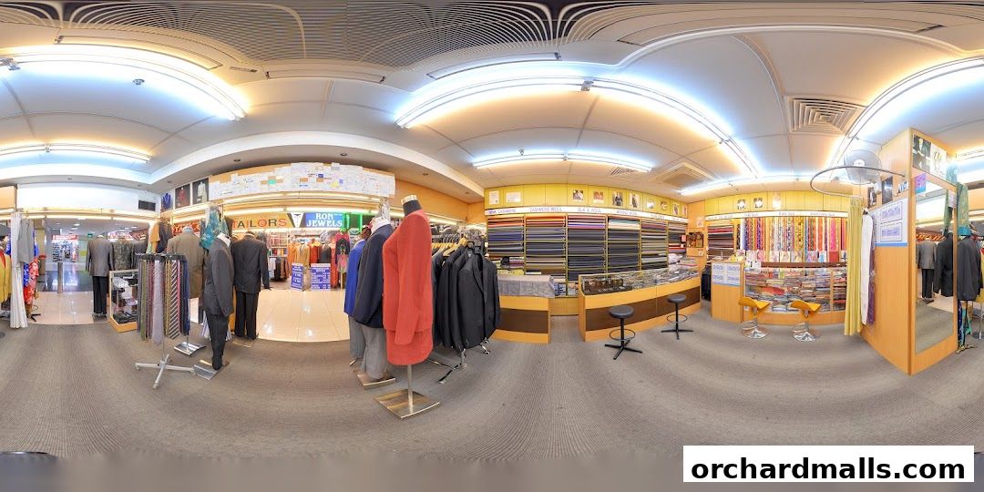 Interior view of Richie's Custom Tailors showcasing fabric rolls, suits on display, and tailoring services.