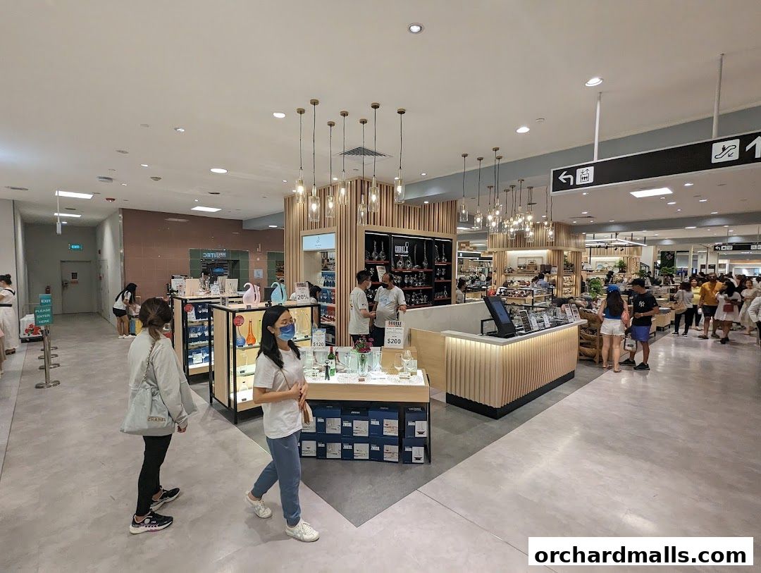 Interior view of a well-lit retail store with customers browsing products.