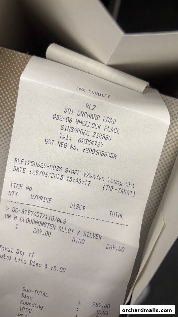 A tax invoice from RL2 at Wheelock Place for a purchase.