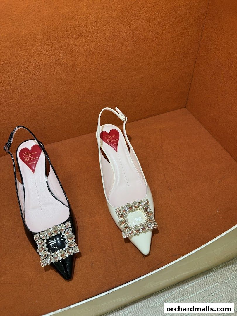 Two elegant Roger Vivier slingback heels, one black and one white, adorned with sparkling square buckles.
