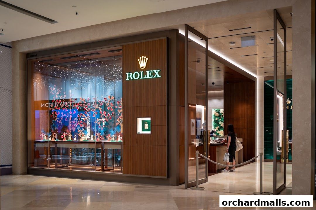 The entrance to a luxurious Rolex boutique with a well-lit display window.