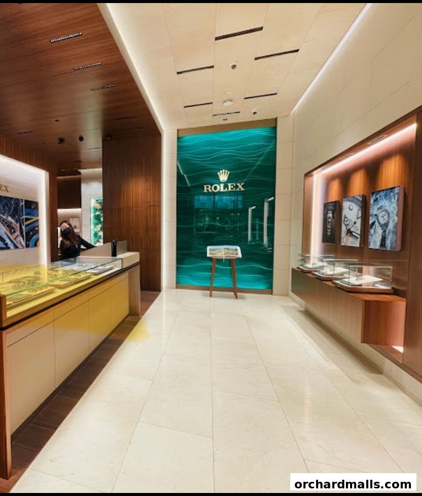 Interior of a luxurious Rolex boutique with display cases and a prominent Rolex logo.