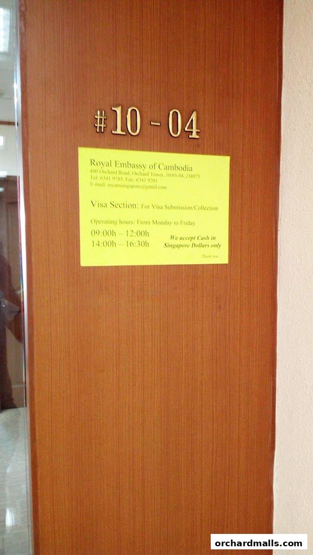 Signage for the Royal Embassy of Cambodia Visa Section with operating hours.