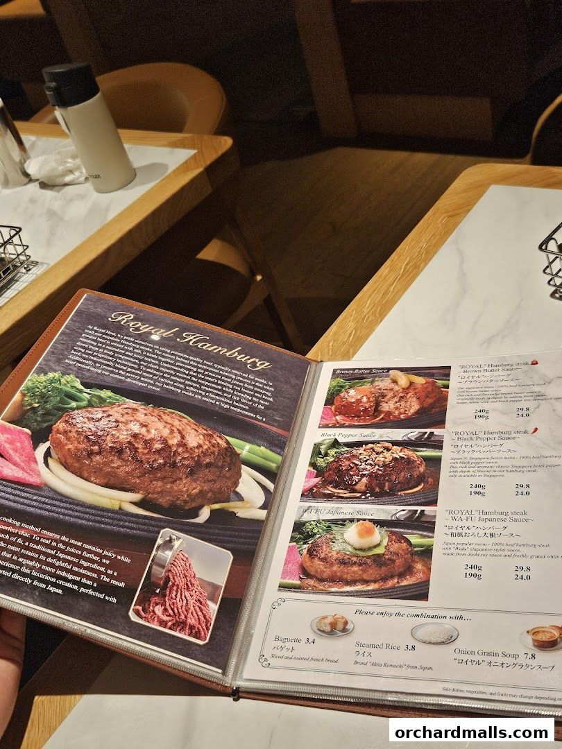 A menu from Royal Host Takashimaya S.C. featuring various hamburg steak options.