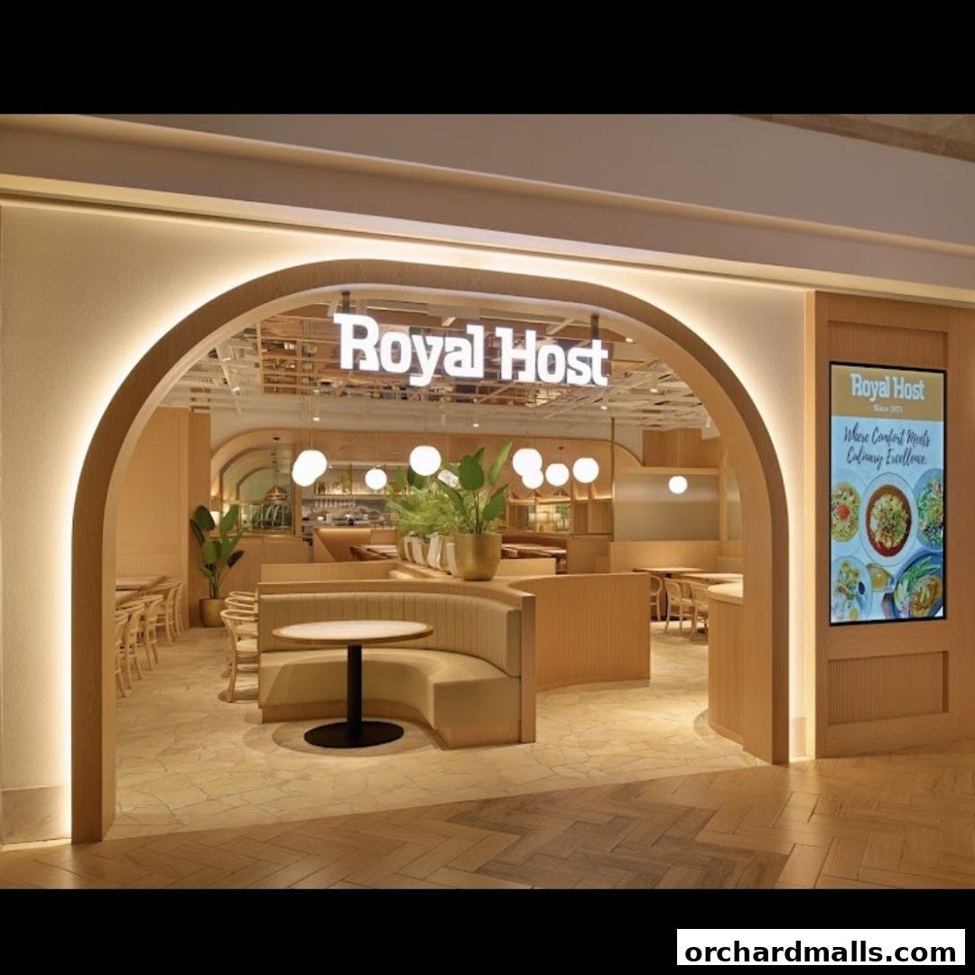 The inviting entrance of Royal Host restaurant with warm lighting and comfortable seating.
