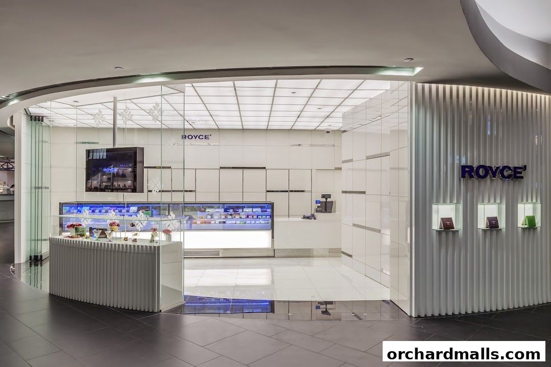 The Royce shop features a clean, modern design with a display case filled with products and a prominent logo.