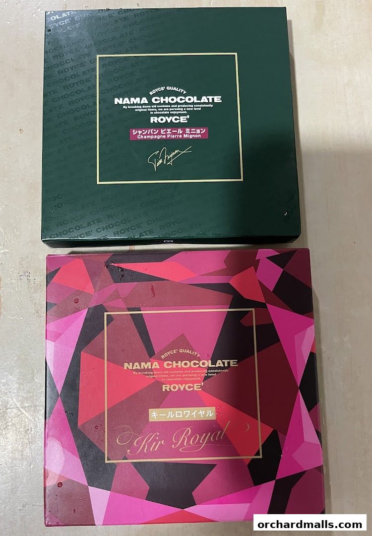 Two boxes of Royce Nama Chocolate, one green and one with a pink geometric pattern.