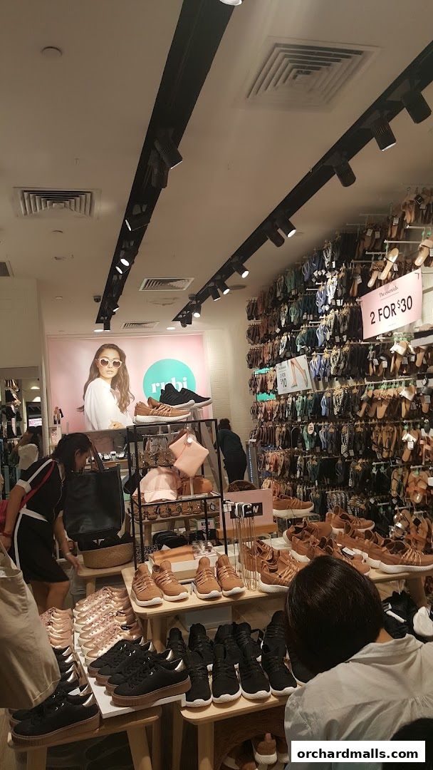 Interior view of Rubi Shoes store showcasing a variety of footwear and accessories.