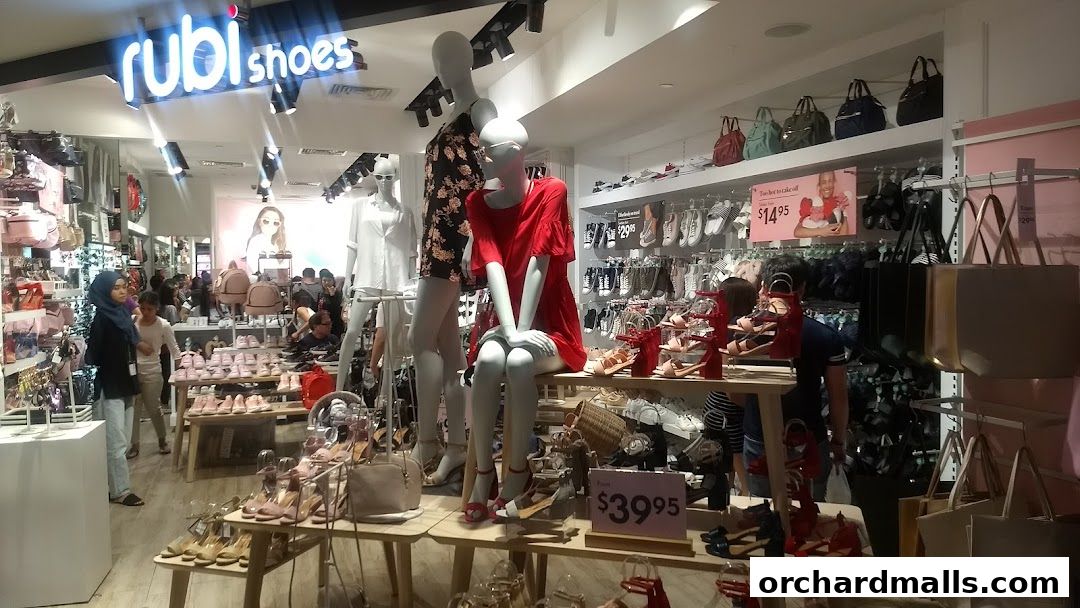 Interior view of Rubi Shoes store showcasing a variety of footwear and handbags on display.