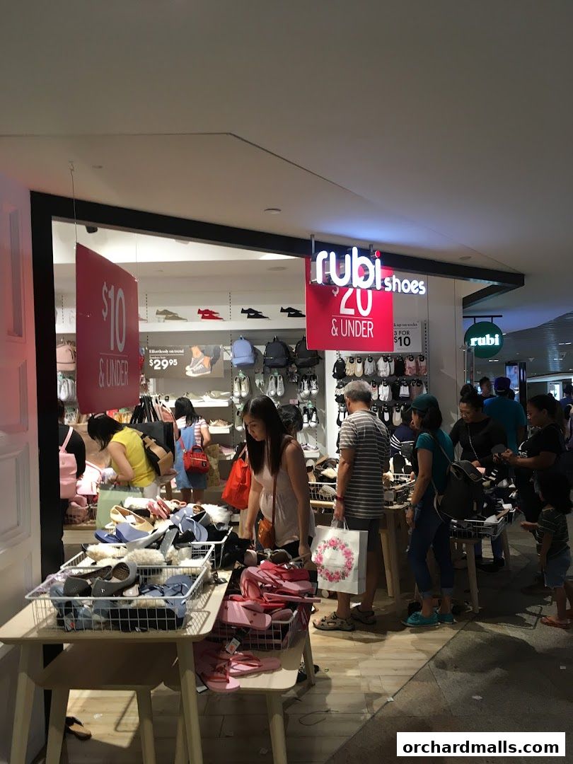 Shoppers browse a wide selection of shoes and accessories at Rubi Shoes.